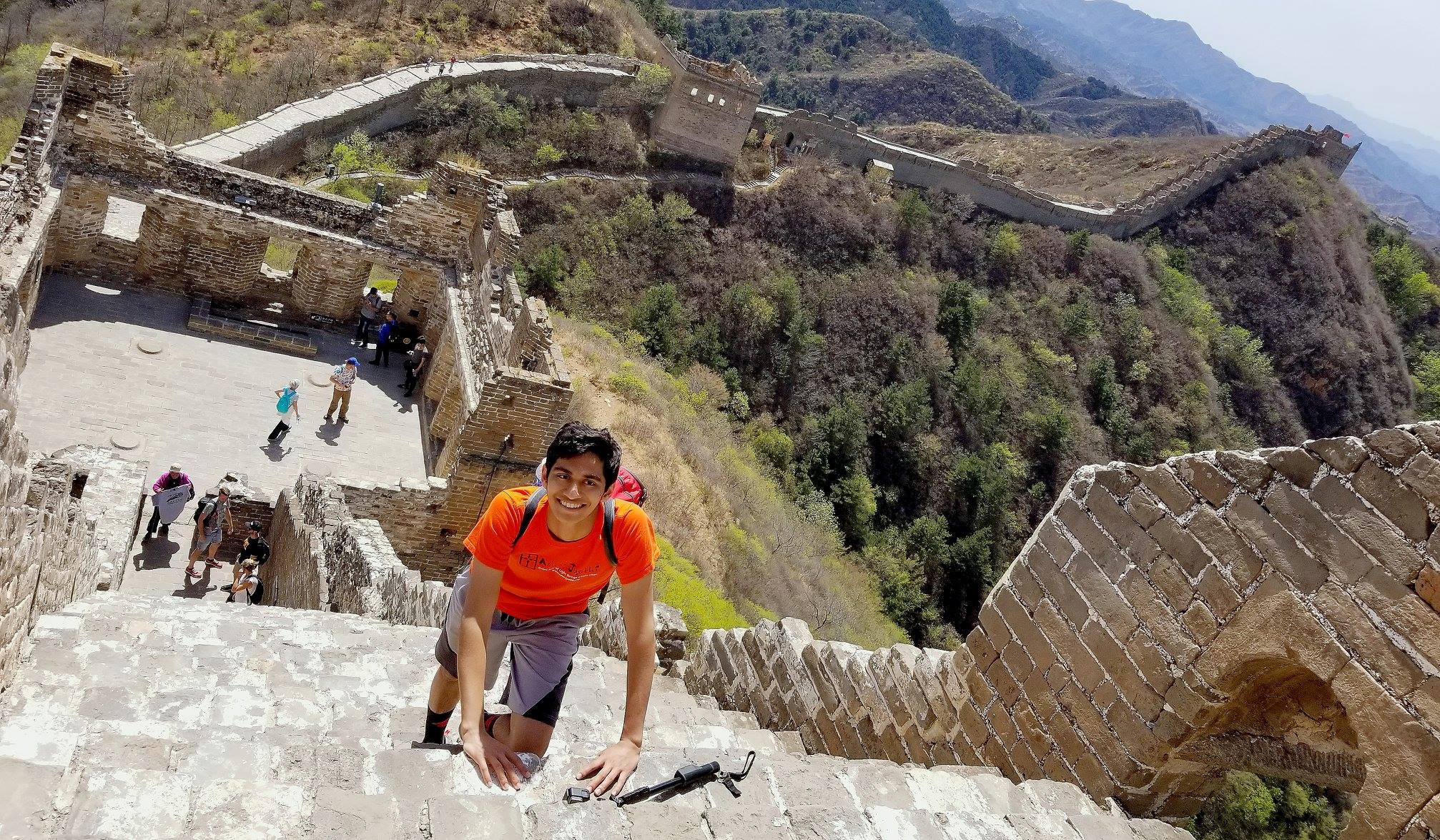 Me climbing the Great Wall of China